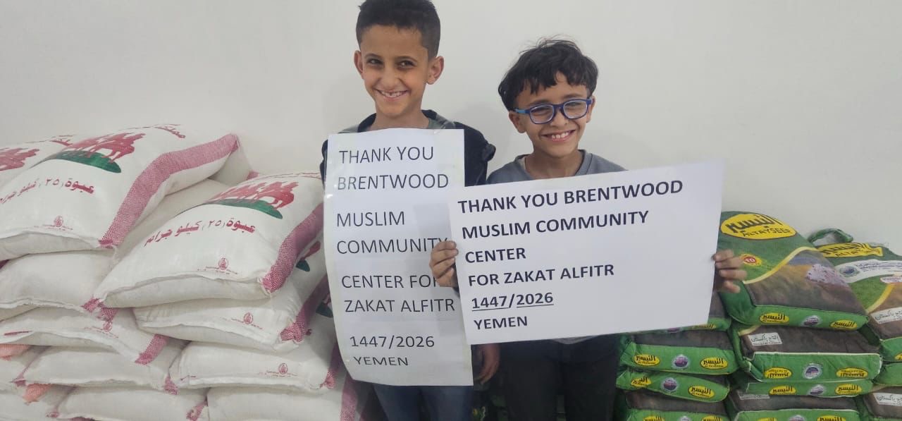 Two boys with food aid in Yemen